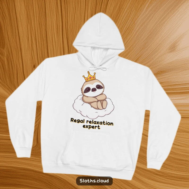 Funny hoodie featuring a majestic sloth wearing a crown, lounging on a cloud, offering warmth and a humorous, regal vibe.