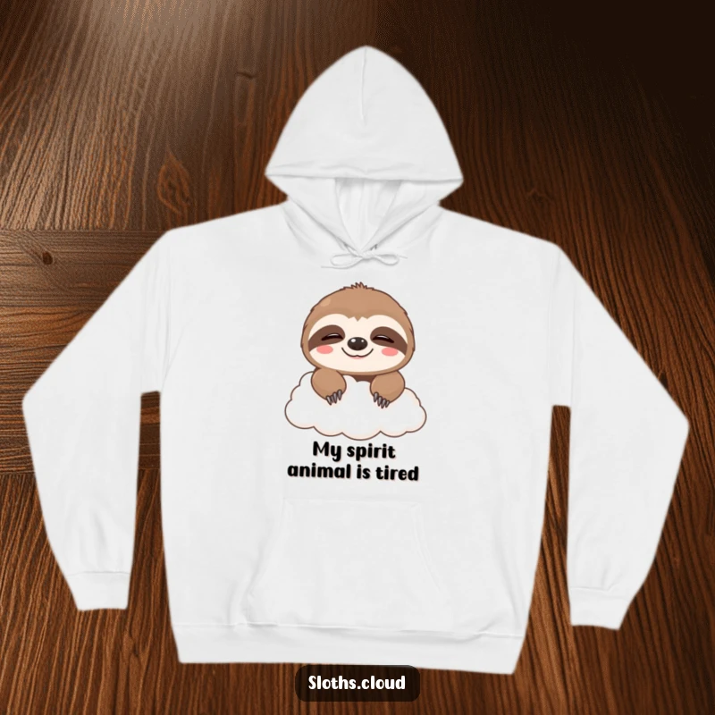 Funny hoodie depicting a cute sloth peeking from behind a cloud with a sleepy, happy grin, emphasizing comfort and humor.